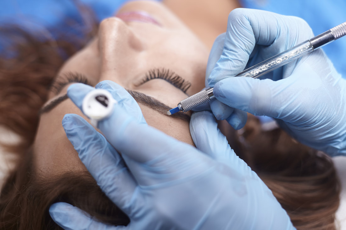 Woman receiving microblading treatment